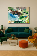 Living room with teal sofa, green armchair, and orange ottoman, featuring a large abstract landscape painting on the wall.